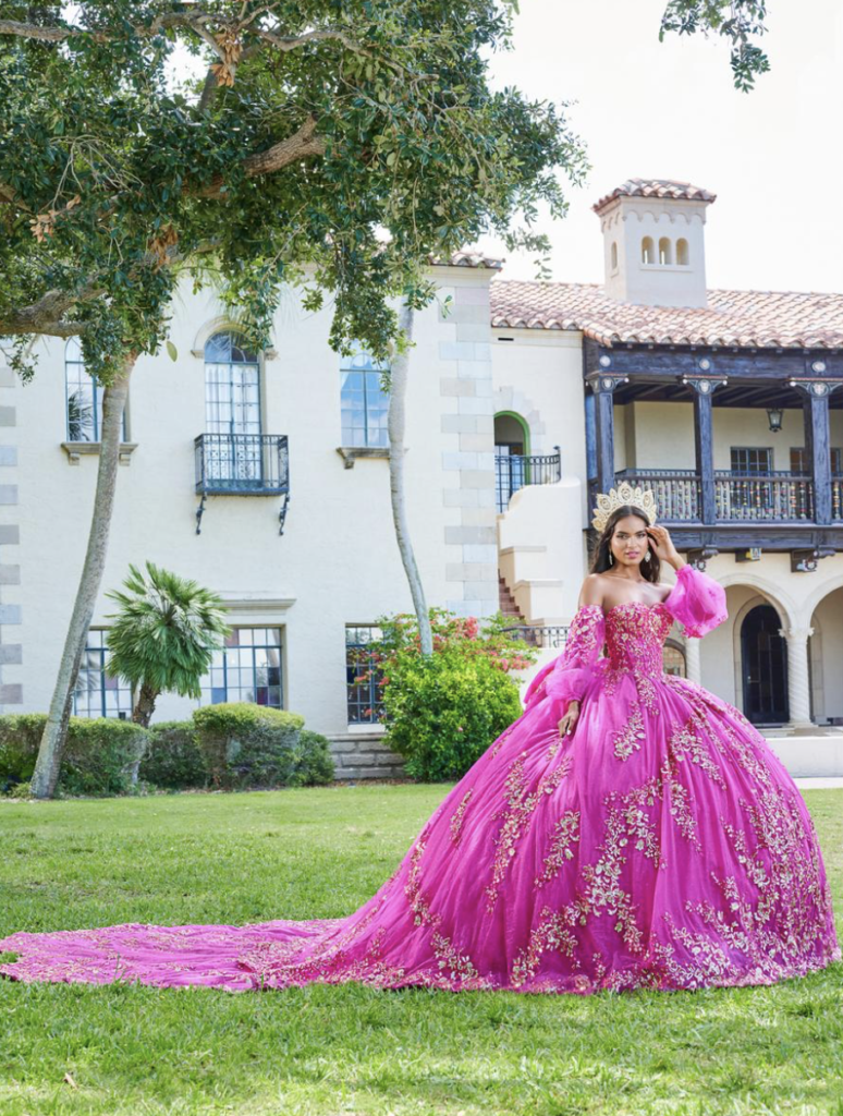 hot pink quinceanera dress outside with Spanish building